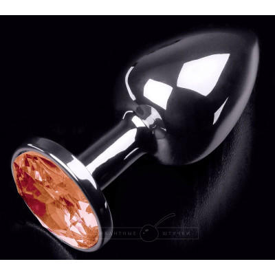 Серебристая анальная пробка с оранжевым кристаллом - 7 см. Серебристая анальная пробка с оранжевым кристаллом - 7 см.