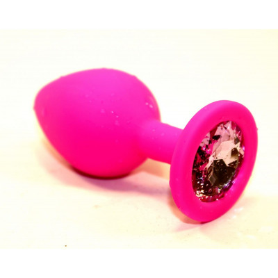 Розовая силиконовая анальная пробка с розовым стразом - 7 см. Розовая силиконовая анальная пробка с розовым стразом - 7 см.