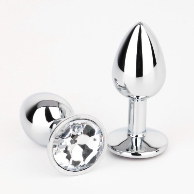 Серебристая анальная втулочка с прозрачным кристаллом - 7 см. Серебристая анальная втулочка с прозрачным кристаллом - 7 см.