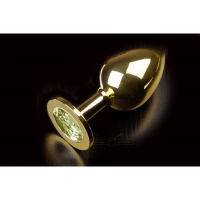 Большая золотая анальная пробка с закругленным кончиком и жёлтым кристаллом - 9 см. Большая золотая анальная пробка с закругленным кончиком и жёлтым кристаллом - 9 см.