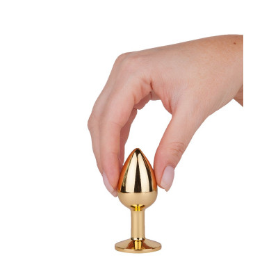 Золотистая анальная втулка с малиновым кристаллом - 7 см. Золотистая анальная втулка с малиновым кристаллом - 7 см.